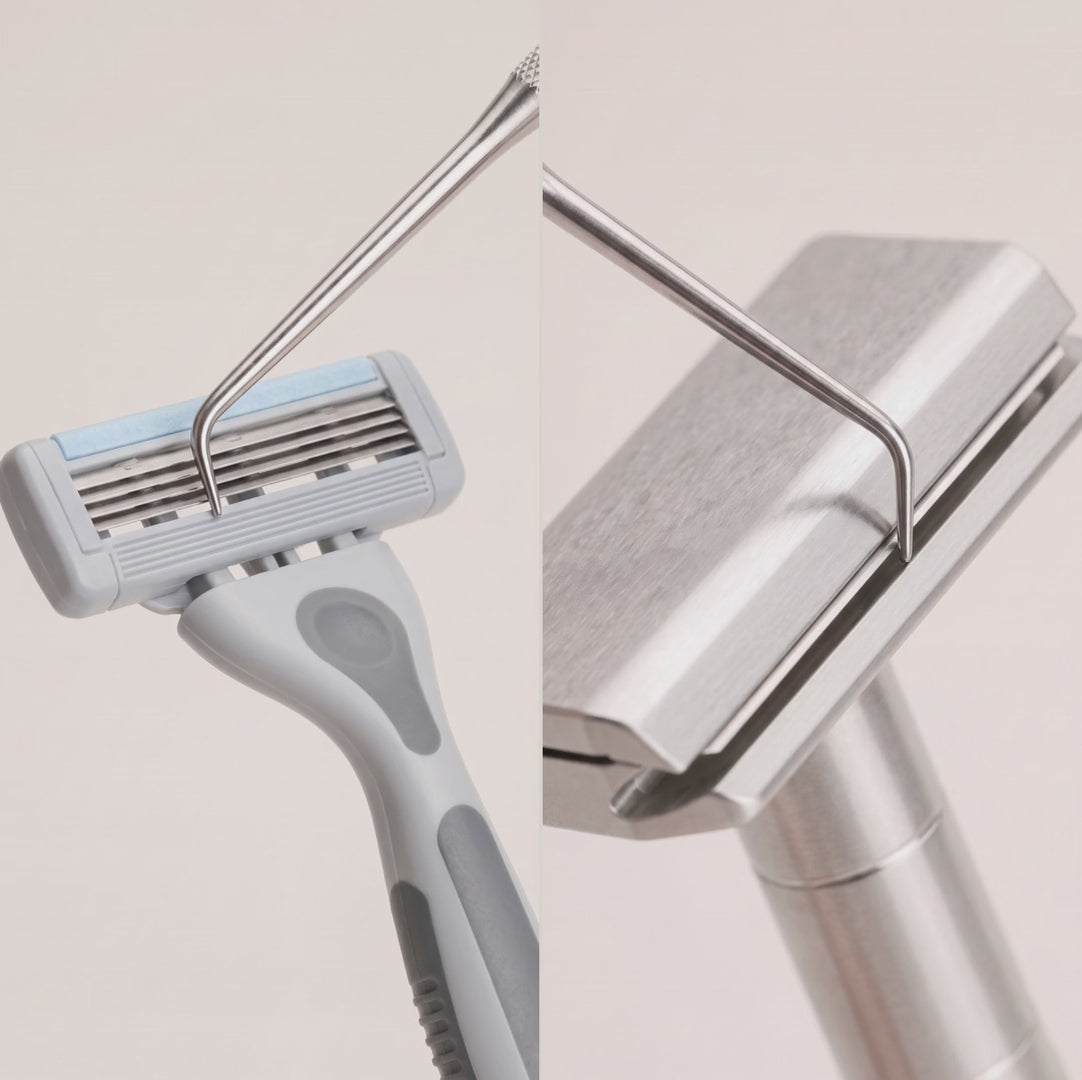 A steel probe presses on the blade edge: the cartridge blades sink and a gap opens; the blade in The Razor, almost flush with the cap and seen in close-up, does not move